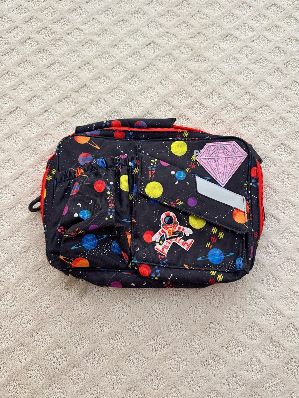 Planetbox Rover/Launch Carry Bag with stickers attached.